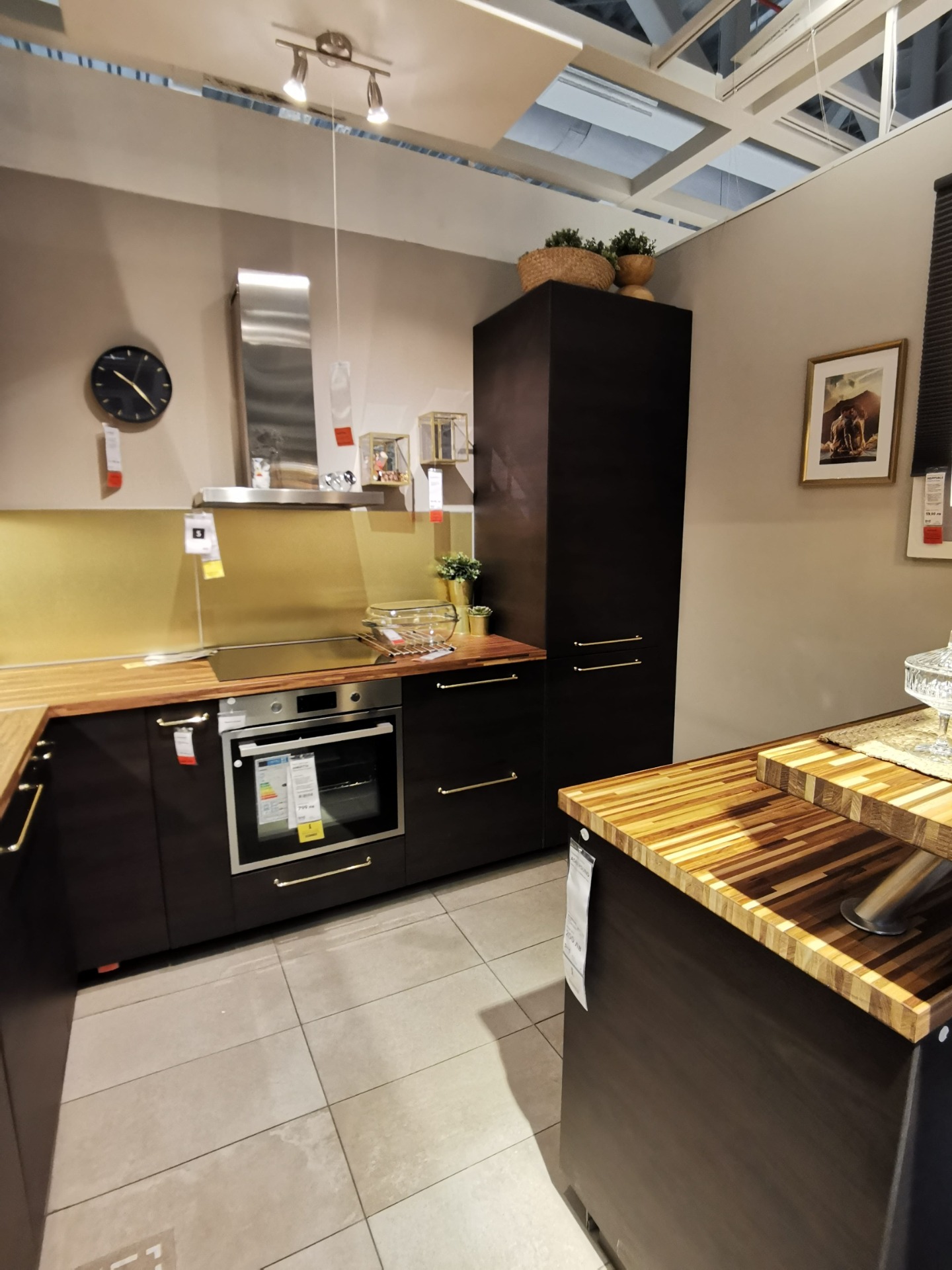 IKEA Askersund dark brown kitchen with Jutis smoked glass door